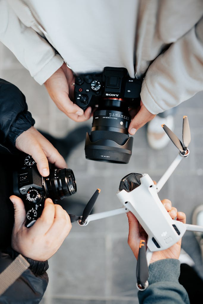 People Holding Electronic Devices